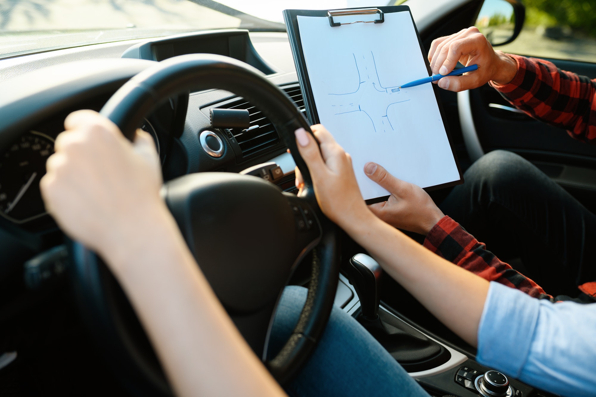 woman-and-man-with-checklist-driving-school.jpg